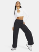 Spodnie dresowe damskie szerokie Nike W Nsw Trend Wvn Mr Pant FQ3588-010 L Czarne (196974881766) - obraz 3