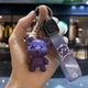 Брелок Мишка KAWS фиолетовый сувенир для ключей и сумки подарок другу стильный брелок (578885) - изображение 2