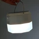 Лампа для кемпінгу New Energy 150W Портативна LED-лампа з сонячною панеллю, 3 акумуляторами 18650, колірною температурою 6500K та гачком для походів та відпочинку Білий - зображення 7