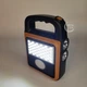 Фонарь аккумуляторный светодиодный LED с солнечной панелью и функцией Power Bank, портативный ручной фонарь-прожектор с зарядкой от USB и 4 режимами света для дома, дачи, кемпинга, A-2301B-Orange - изображение 9