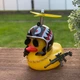 Декоративный аксессуар Crazy Duck желтая утка на торпеду в авто с оружием в шлеме - изображение 1