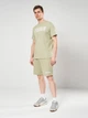 Шорты хлопковые короткие мужские Puma Essentials Graphics 69179082 M Lux Army (4069161975622) - изображение 3