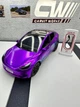 Колекційна модель Tesla Model Y із зарядною станцією, 1:24, фіолетовий металік - изображение 1