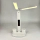 Лампа настольная светодиодная с LED-дисплеем и часами, складной аккумуляторный светильник для чтения и обучения с регулировкой яркости, 3 режимами света и подставкой органайзером, для офиса и дома, SLV-26-White - изображение 4
