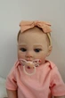 Лялька Реборн Reborn Doll 50 см, реалістична вініл-силіконова дівчинка пупс в рожевому одязі+аксесуари - зображення 7
