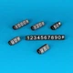 Набор пластиковых ценников с цифрами Lesko L 100 шт 6×9 мм черный с белыми цифрами для товаров на витрину - изображение 1