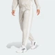 Женские джоггеры Train Essentials 3-Stripes Woven adidas JD6522 (XS) бежевый (4067891735998) - изображение 1