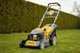 Бензиновая газонокосилка Powermat PM0614 7 л.с. 60 л с мульчированием самоходная с регулировкой высоты держатель для напитков - изображение 1