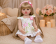 Реалістична лялька реборн Reborn Baby Doll Liliana 55 см – вінілова дівчинка з довгим волоссям та аксесуарами, можна купати - изображение 4