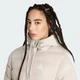 Жіноча куртка Essentials CLIMAWARM 3-Stripes Synthetic Down Hooded adidas KS7708 (XS) бежевий (4068804760793) - зображення 4