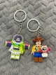 Парные брелоки Toy Story Базз Лайтер (Buzz Lightyear) и Вуди (Woody) Лего История Игрушек Брелки - изображение 1