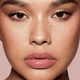 Помада блеск для губ Fenty Beauty by Rihanna Gloss Bomb Stix High-Shine Gloss Stick 04 Is It Fu$$Y Dusty Pink 3.6g - зображення 3