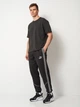 Спортивные штаны мужские Puma Teamking 66053503 L Black-White-Black (4069157144179) - изображение 3
