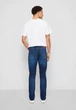 Джинси чоловічі Tommy Jeans RYAN Relaxed Fit Jeans у темно-синьому кольорі (Aspen Dark Blue Stretch) 28/32р - зображення 5