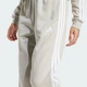 Женские джоггеры Essentials 3-Stripes Fleece Loose-Fit adidas JX7697 (2XS) бежевый (4068807269705) - изображение 4