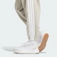 Женские джоггеры Essentials 3-Stripes Fleece Loose-Fit adidas JX7697 (2XS) бежевый (4068807269705) - изображение 5