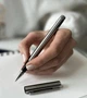 Подарочная письменная ручка именная с индивидуальной гравировкой металлическая на подарок для мужчины и женщины серебристая с черной гелевой пастой в подарочном футляре - изображение 4
