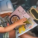 Развивающий центр на подголовник авто Taf Toys Книжка путешественника с зеркалом - изображение 8