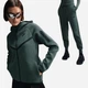 Спортивний костюм жіночий Nike Tech Fleece Windrunner Full‑Zip XS Зелений HV6747-338__HV6779-338 - зображення 1