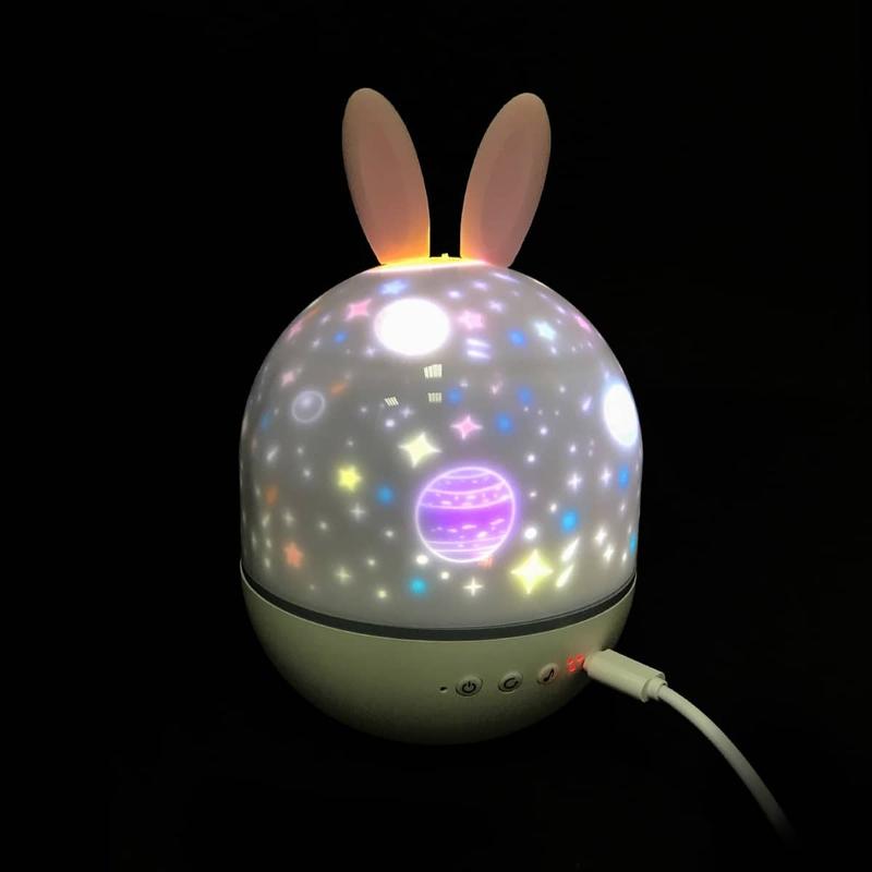 

Ночник-проектор светодиодный в форме зайчика Cute Elf вращающийся с проекционной лампой и картинками для проекции, музыкальным сопровождением и световыми эффектами пульт ДУ USB 11х15 см Белый (Night light-2)