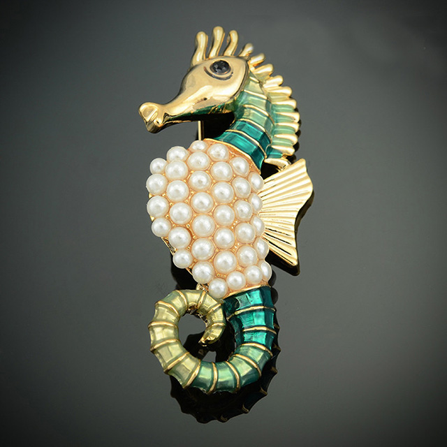 

Брошь Морской конек DiaDemaGrand Золотой с зеленым (111538-8-7)