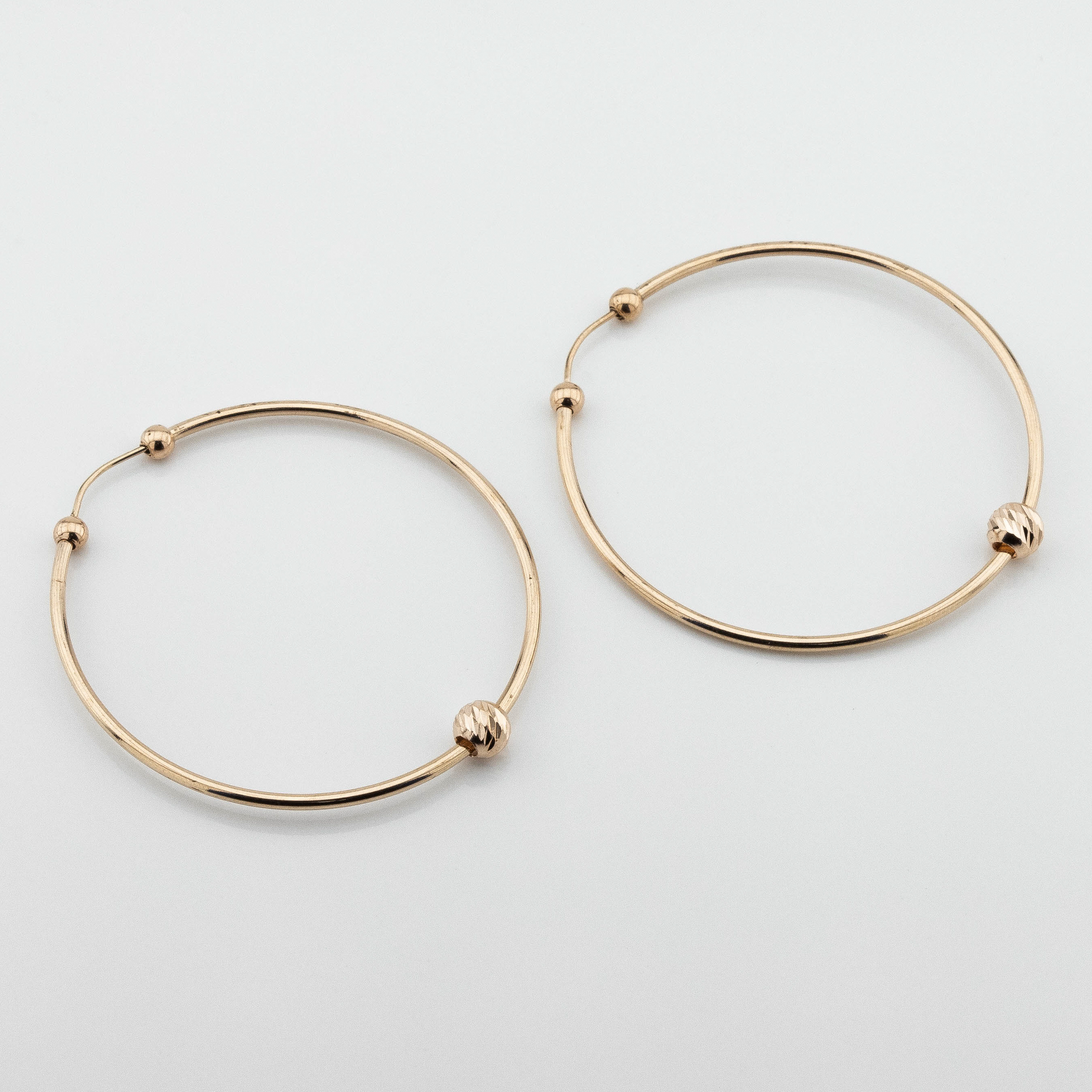 

Серьги-кольца с шариком из красного золота c121753 Диамант