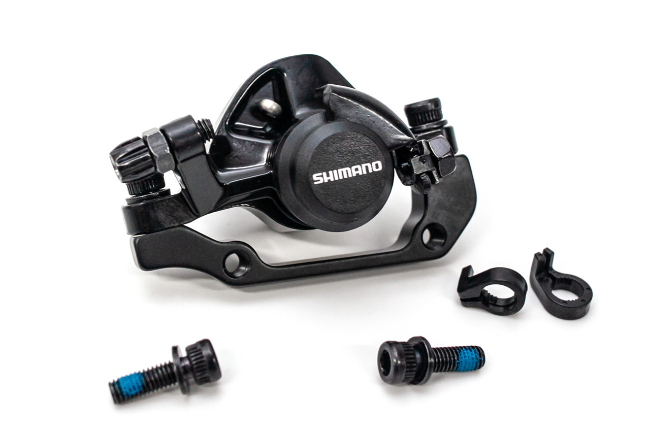 

Тормоз дисковый механический задний SHIMANO BR-TX805 с адаптером под 160 мм.