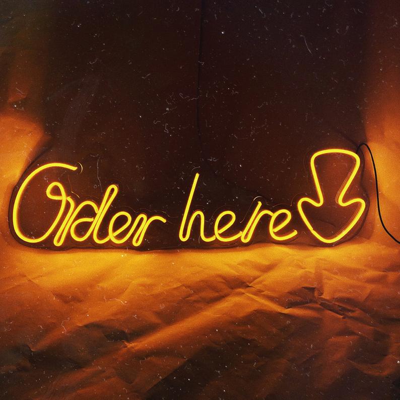 

Неоновая вывеска «Order here»