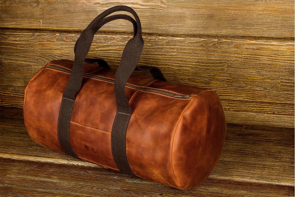 

Кожаная дорожная сумка мужская GRANDE PELLE 45х21,5х24 см (sum0012537) Рыжий