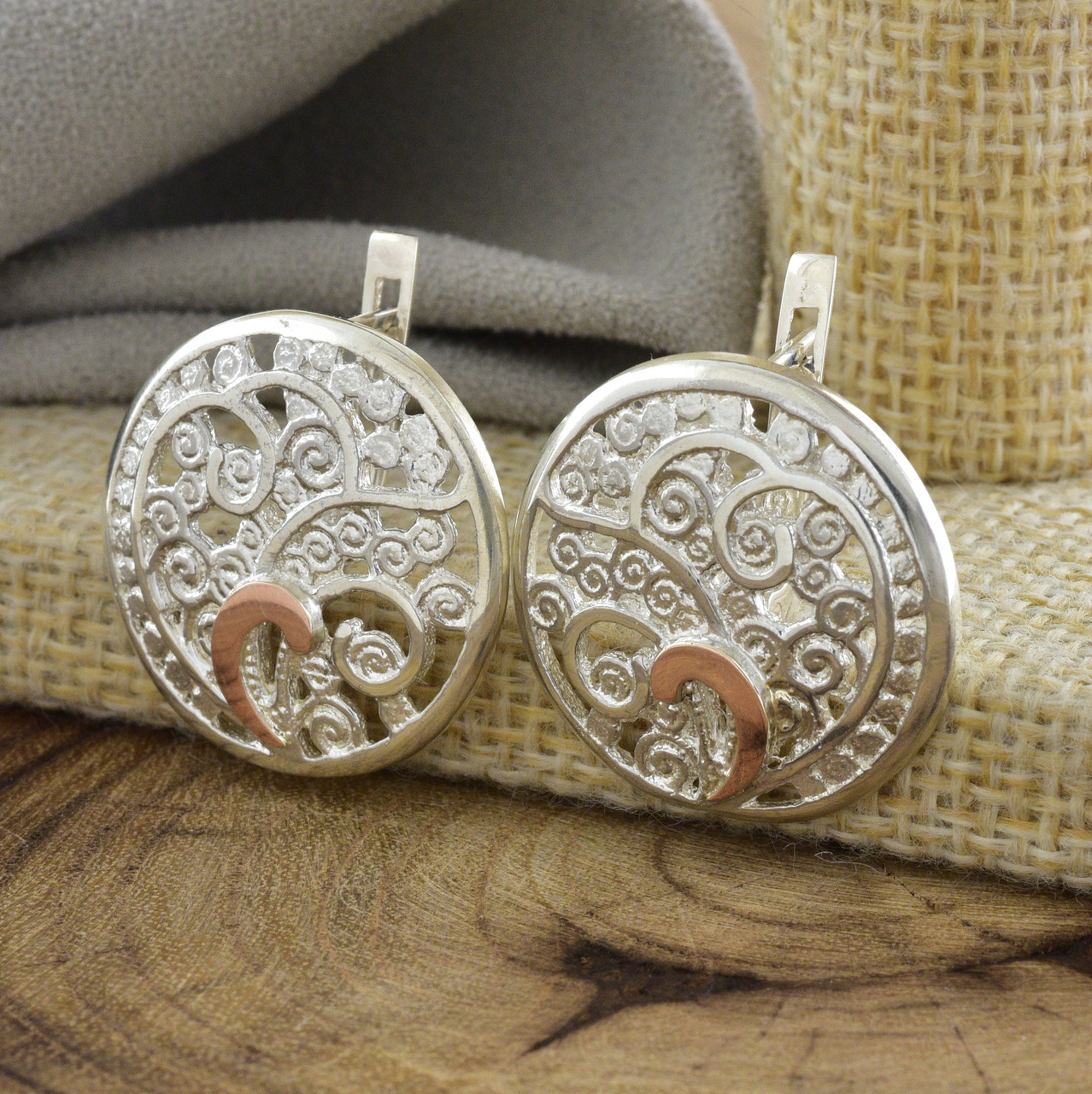 

Срібні сережки з золотом Тропіканка розмір 24х24 мм вставка білі фіаніти вага 8.2 г