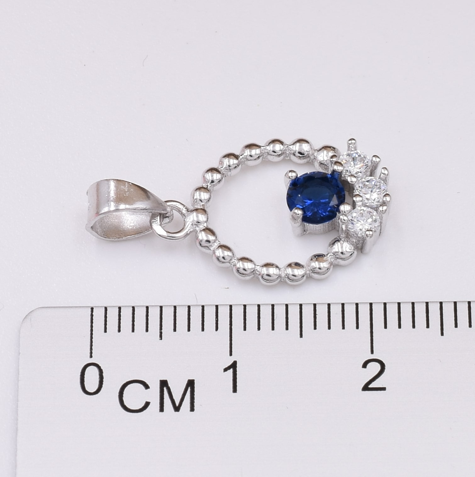 

Серебряный кулон размер 22х12 мм вставка синие фианиты вес 1.3 г