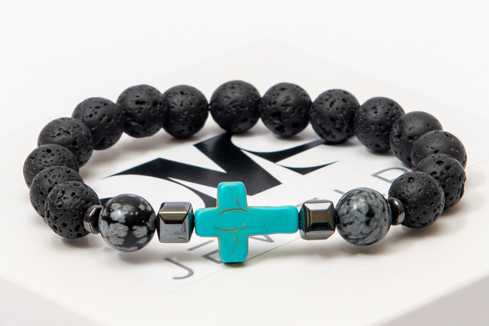 

Браслет DMS Jewelry мужской и женский из натуральных камней Ø 8мм: лава, гематит (синт.), снежный обсидиан, бирюза (синт) GREY CROSS