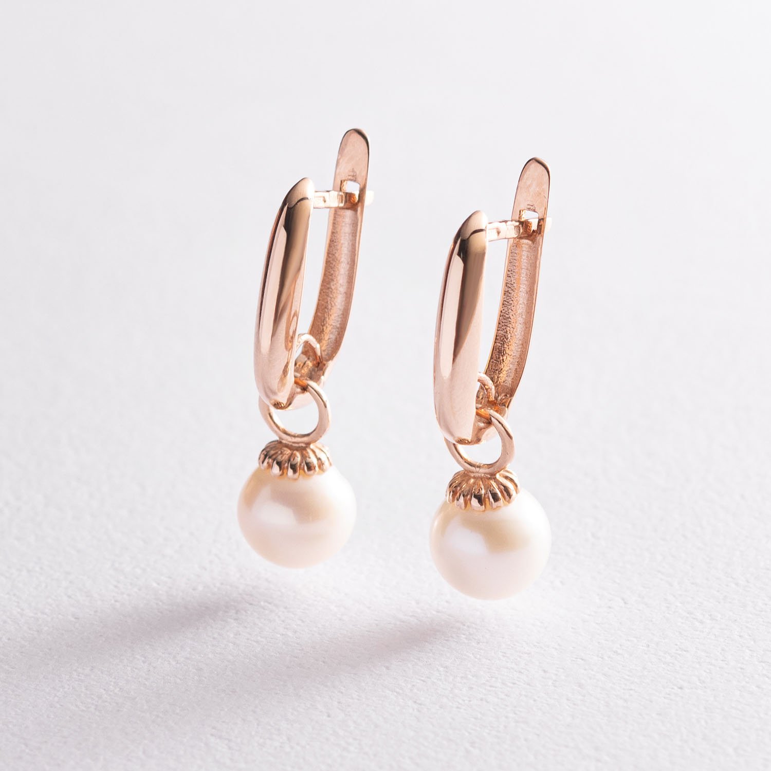 

Золотые серьги с жемчугом с07529 Оникс