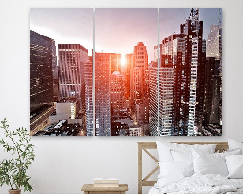 

Модульная картина на холсте из трех частей Восход солнца в Нью-Йорке 128x81 см