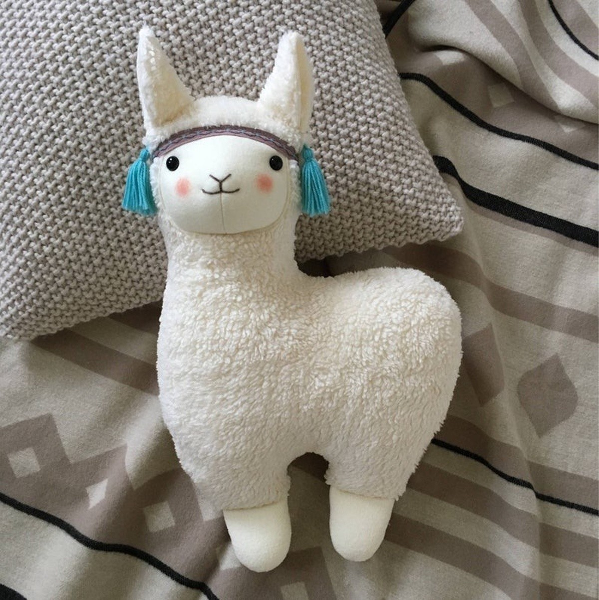 

Декоративная подушка ручной работы Madana Studio высота 50см "Лама с голубыми кисточками"