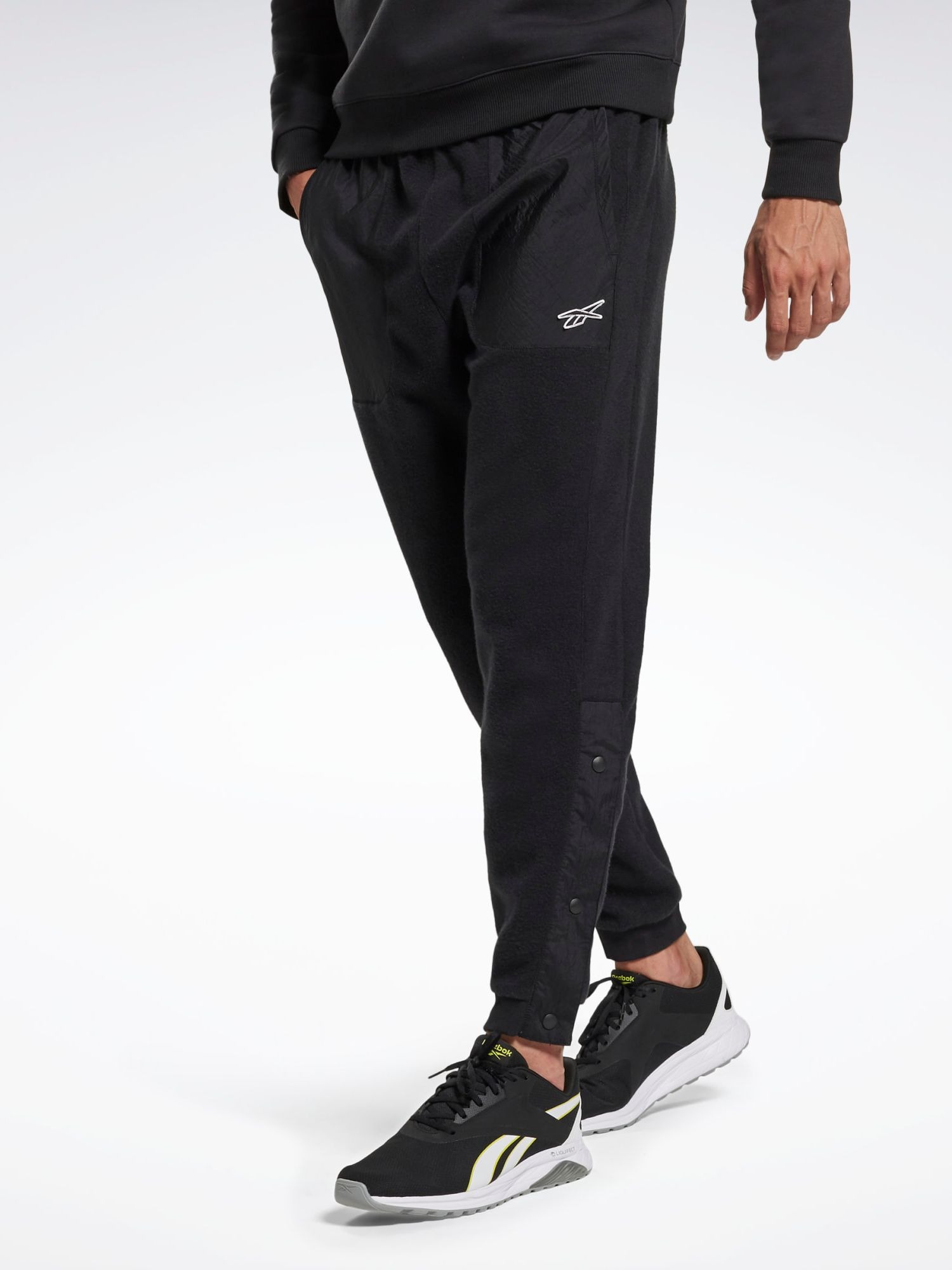 Акція на Спортивні штани чоловічі Reebok Myt Pant GT5797 58 Black від Rozetka