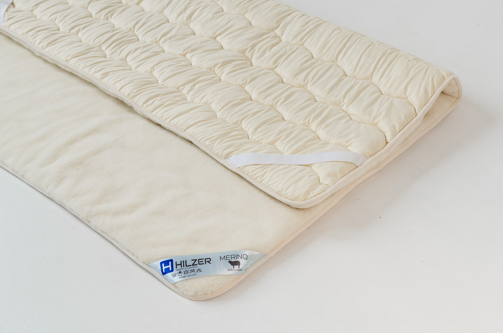 

Наматрасник из элитного полотна овечьей шерсти породы Меринос 220х200 MERINO Hilzer цвет Белый