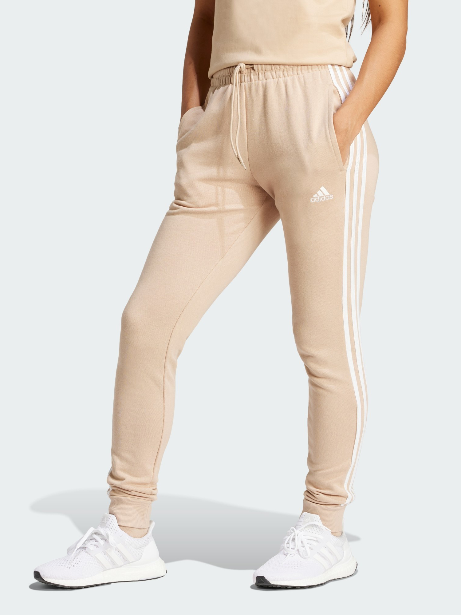 Акція на Спортивні штани жіночі Adidas W 3S Ft Cf Pt IR5378 L Magic Beige від Rozetka