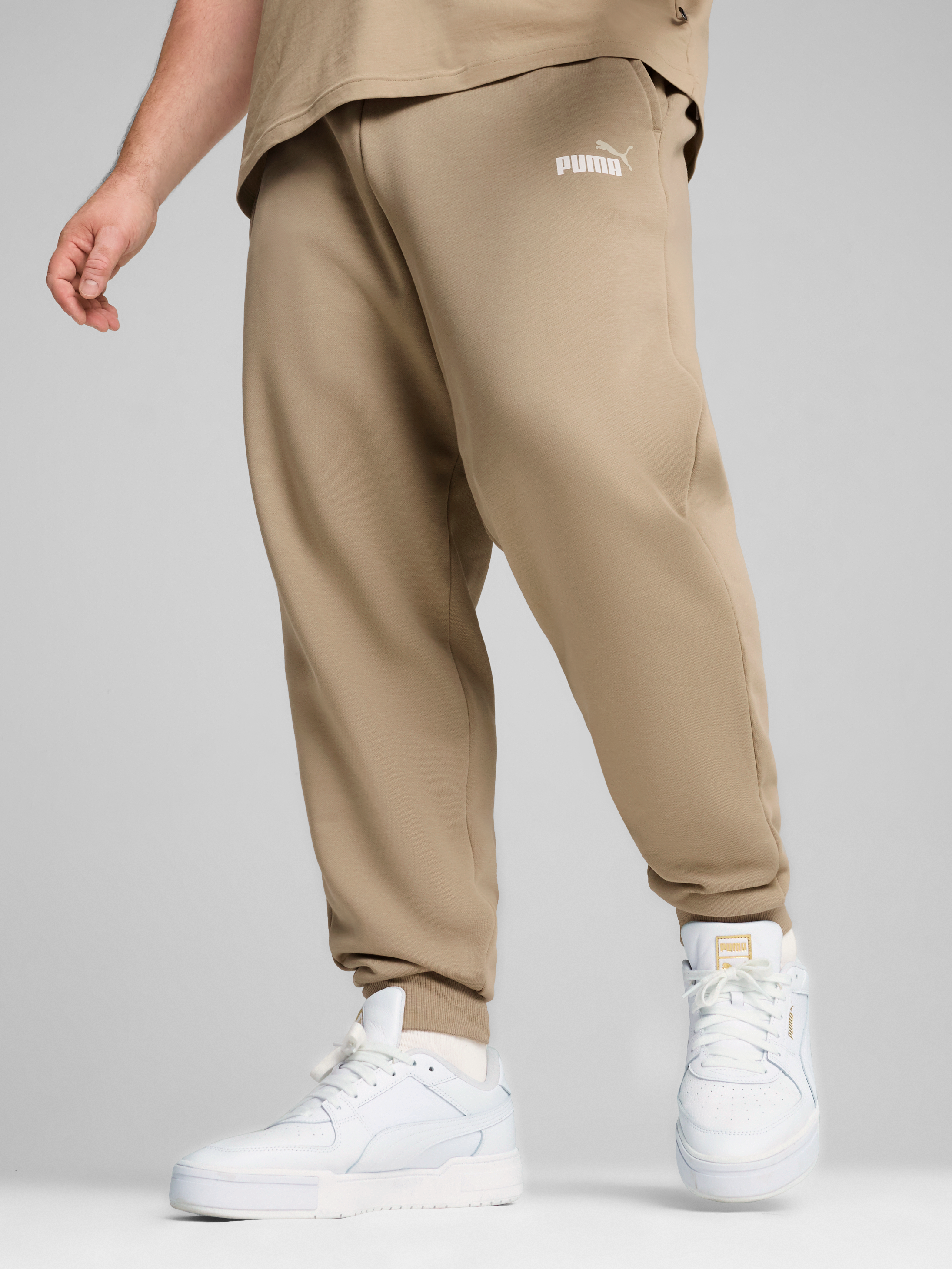 Акція на Спортивні штани чоловічі Puma Ess+ 2 Col Logo Pants 58676766 L Бежеві від Rozetka