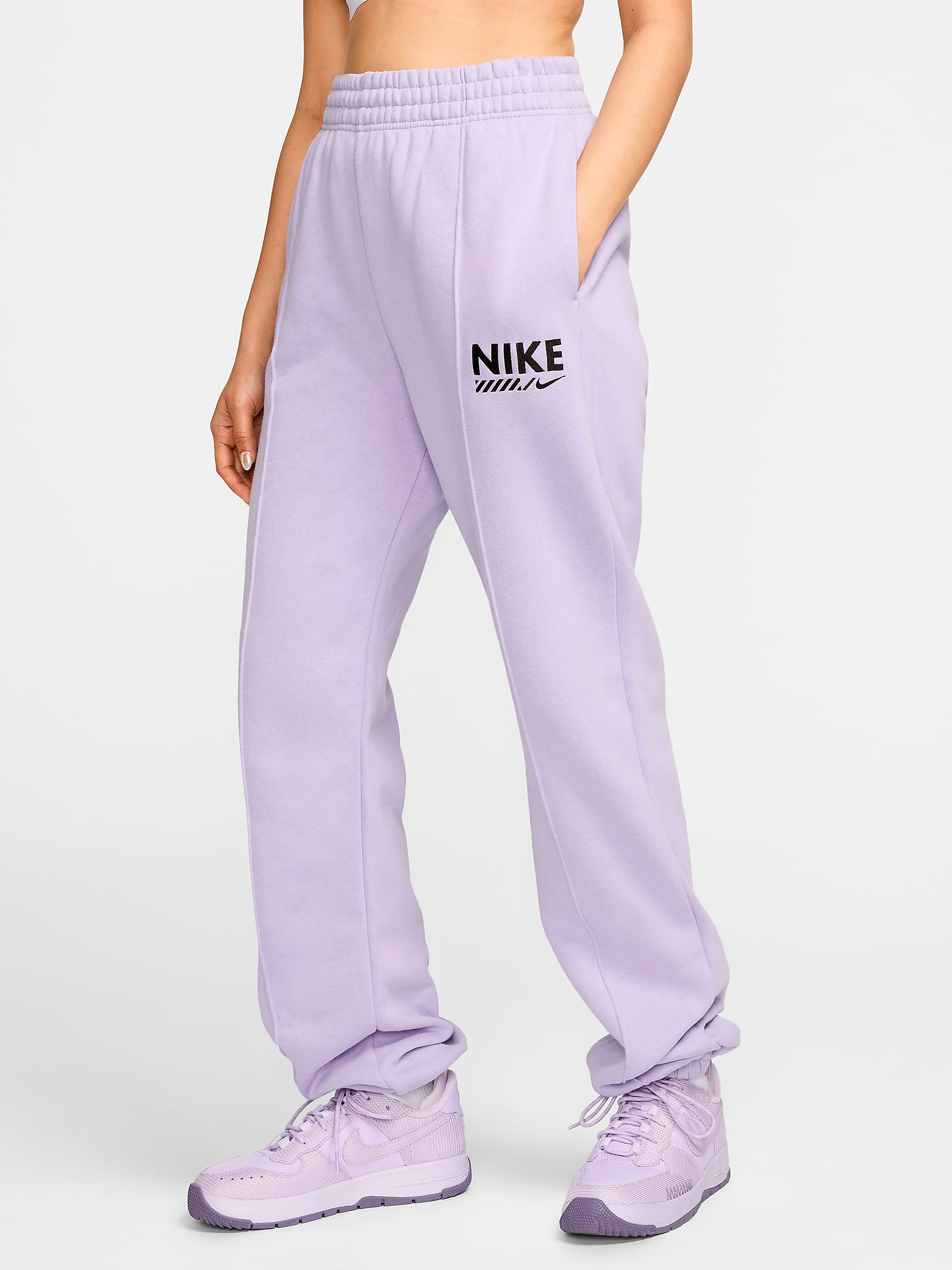 Акція на Спортивні штани на флісі жіночі Nike W Nsw Flc Pant Gls HM4319-515 M Лілові від Rozetka