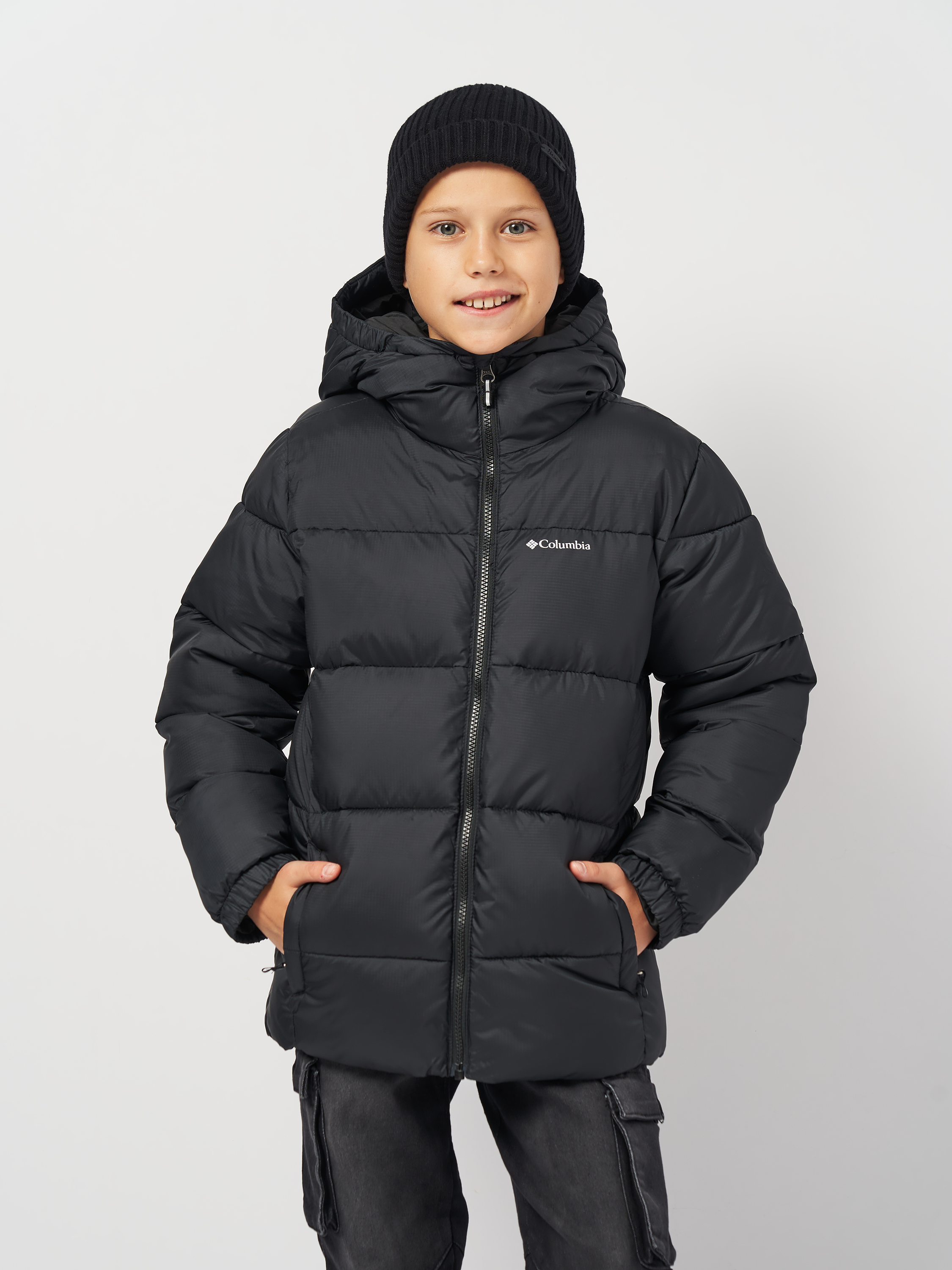 Акція на Дитяча зимова стьобана куртка для хлопчика Columbia Puffect Hooded Jacket 2096271-010 128-134 см Чорна від Rozetka