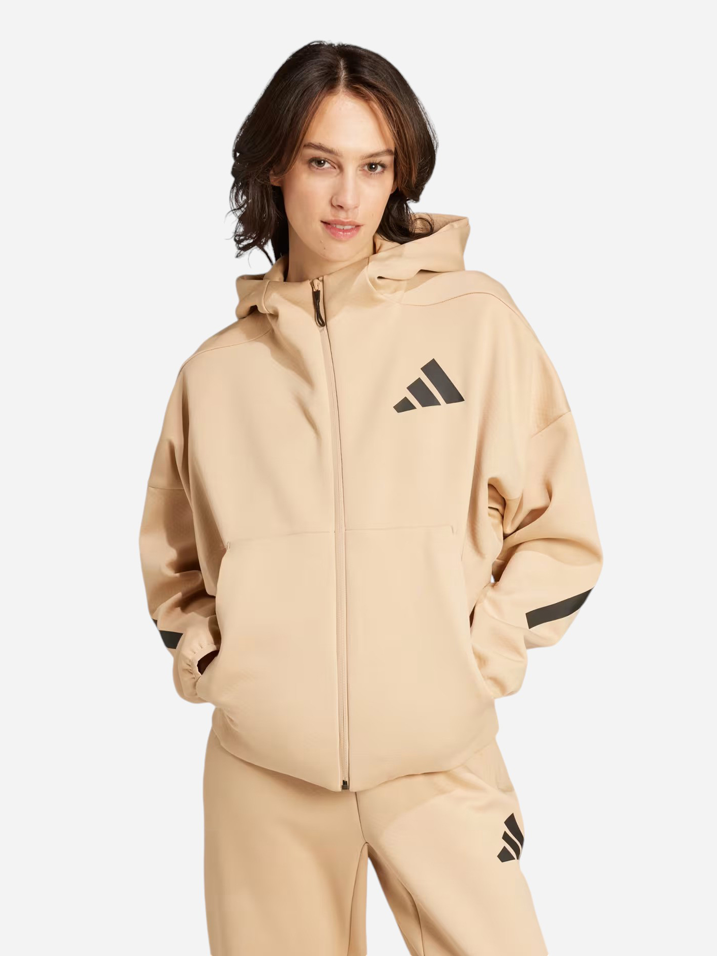 Акція на Толстовка на блискавці з капюшоном жіноча Adidas W Z.N.E. Fz JD9594 XL Бежева від Rozetka