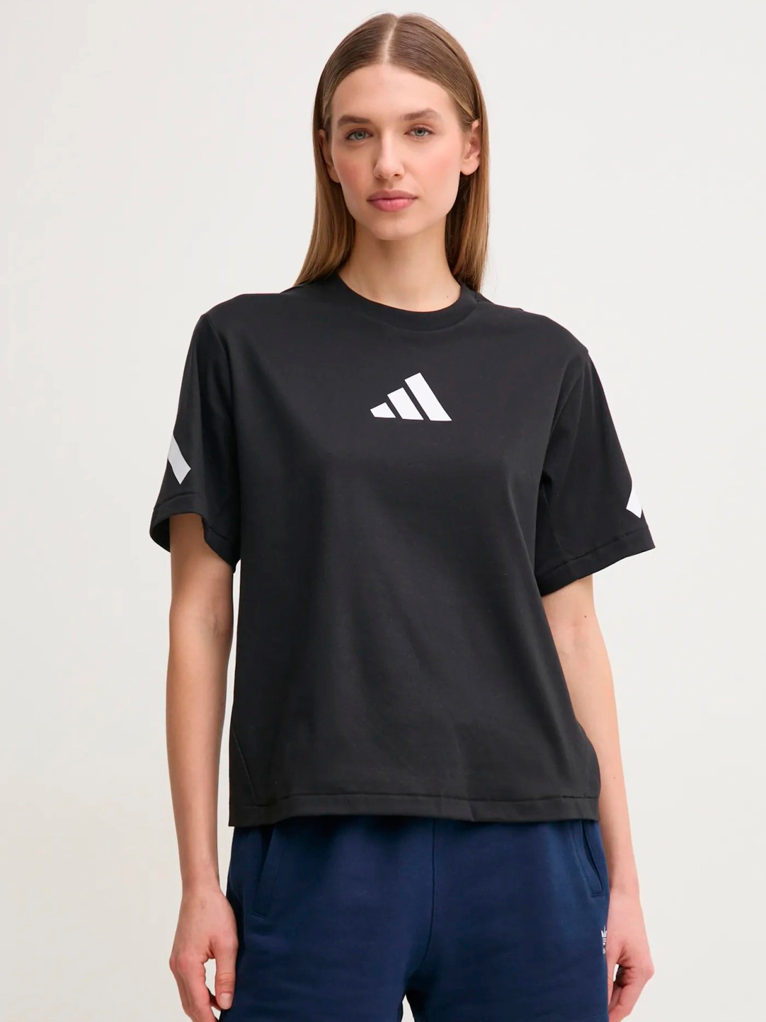 Акція на Футболка бавовняна жіноча Adidas W Z.N.E. Tee JJ4778 M Black/White від Rozetka