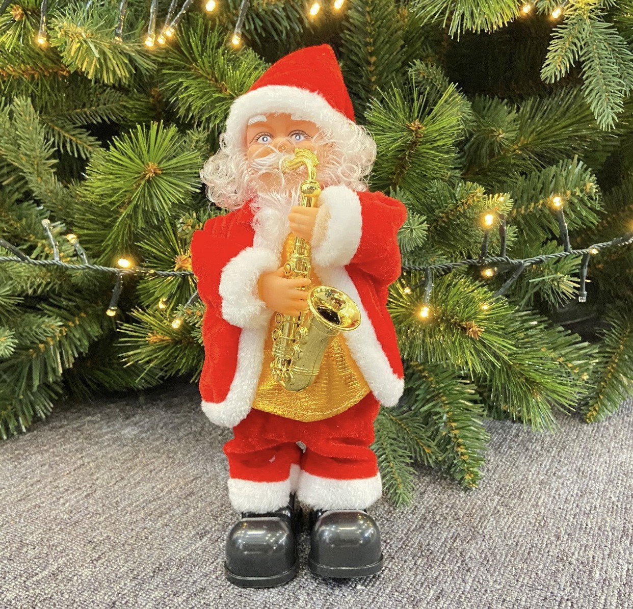 

Дед Мороз Merry Christmas играющий на саксофоне на батарейках 26 см