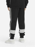 Дитячі теплі спортивні штани на флісі для хлопчика Puma Ess+ Colorblock Pants Fl Cl B 849083-01 110 см Чорні (4064535821505) - зображення 2