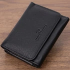 Шкіряний молодіжний гаманець для жінок ST Leather чорного кольору на маленькій кнопці (bg225fash06)